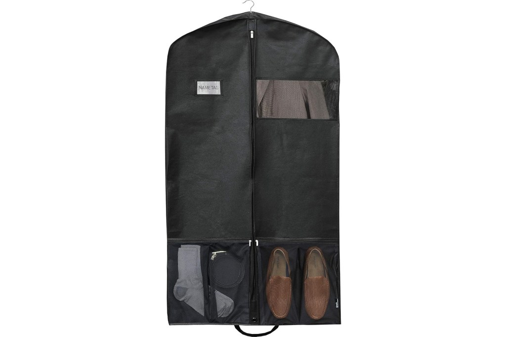 Black dress bag with shoes inside